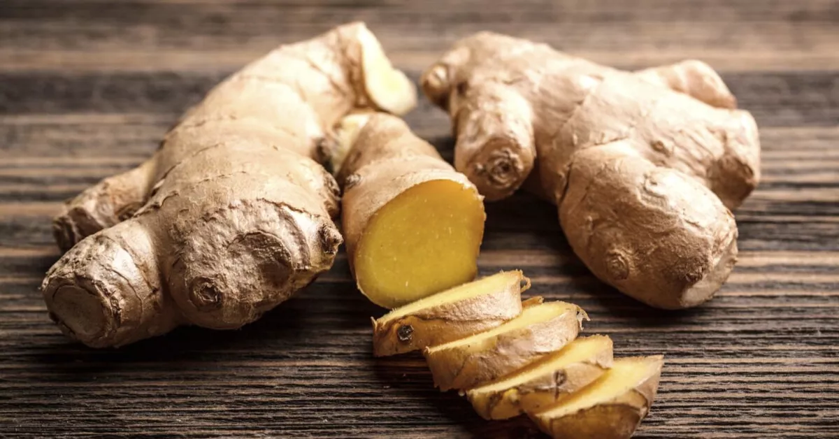 Fresh ginger root, whole and sliced